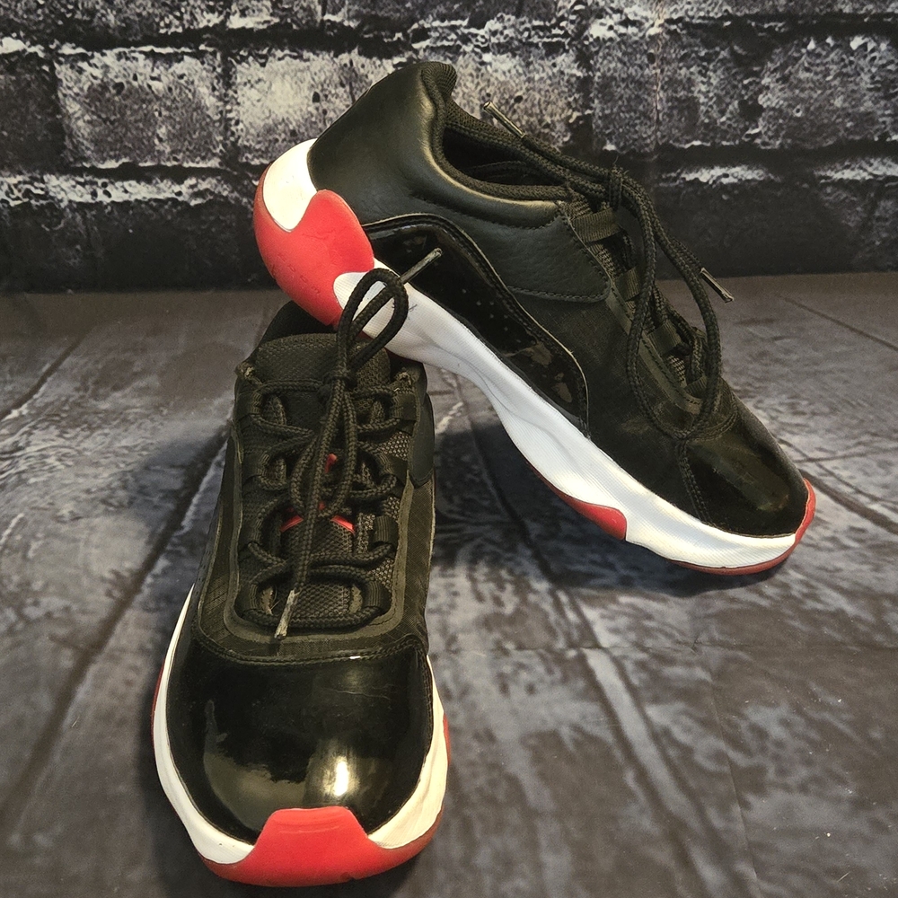 Black and Red Jordan 11 Bred Sneakers 7Y